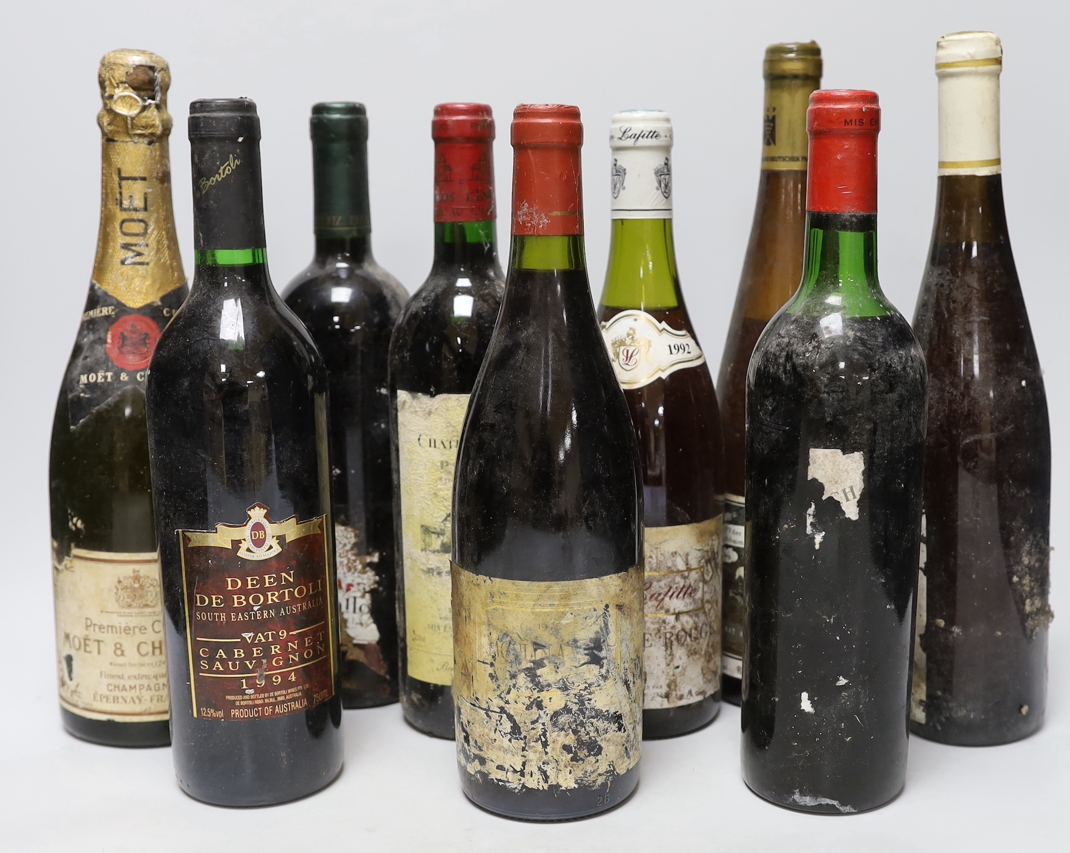 A bottle of Moët Chandon champagne and eleven various bottles of wine to include 1992 Jean Lafitte Bourgogne Rouge, 1994 Chateau L’Enclos Pomerol, 1975 Chateau Batailley Pauillac, 1994 Deen De Bortoli Cabernet Sauvignon
